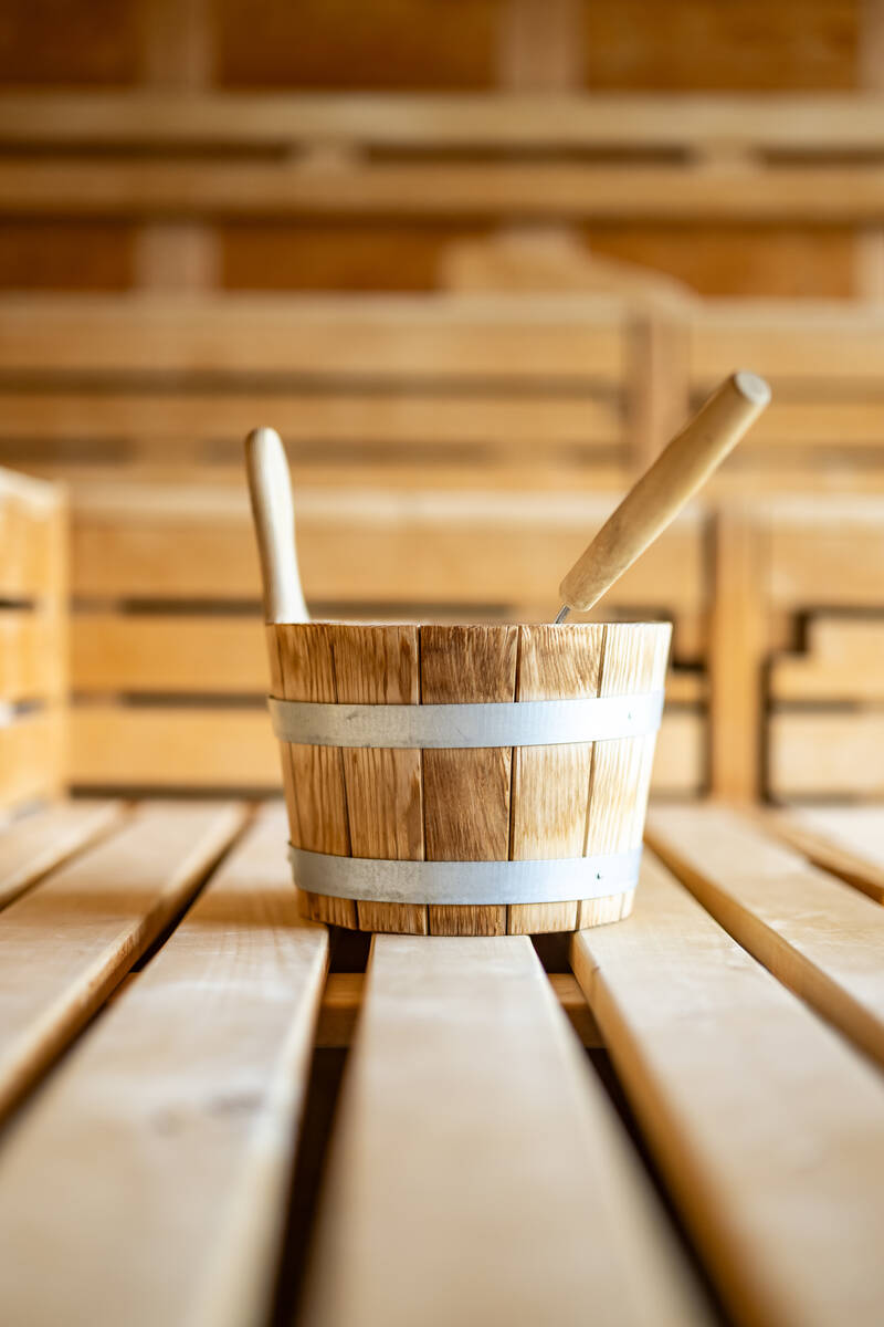 A wooden sauna bucket in one of the AllgäuSternHotel's saunas.